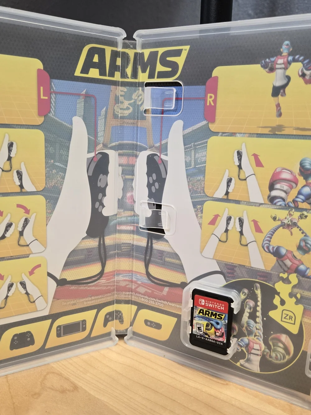 Nintendo ARMS Switch Game – Yellow, Blue & Pink Cover